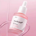 Close-up of Medicube Pink Peptide Serum texture and dropper